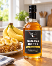 Load image into Gallery viewer, Firebee Banana Honey 19oz glass bottle beside peanut butter toast topped with banana slices
