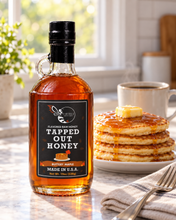 Load image into Gallery viewer, Firebee Tapped Out Honey 19oz glass bottle on a farmhouse table
